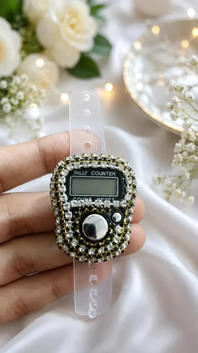 Holding the digital Tasbeeh counter